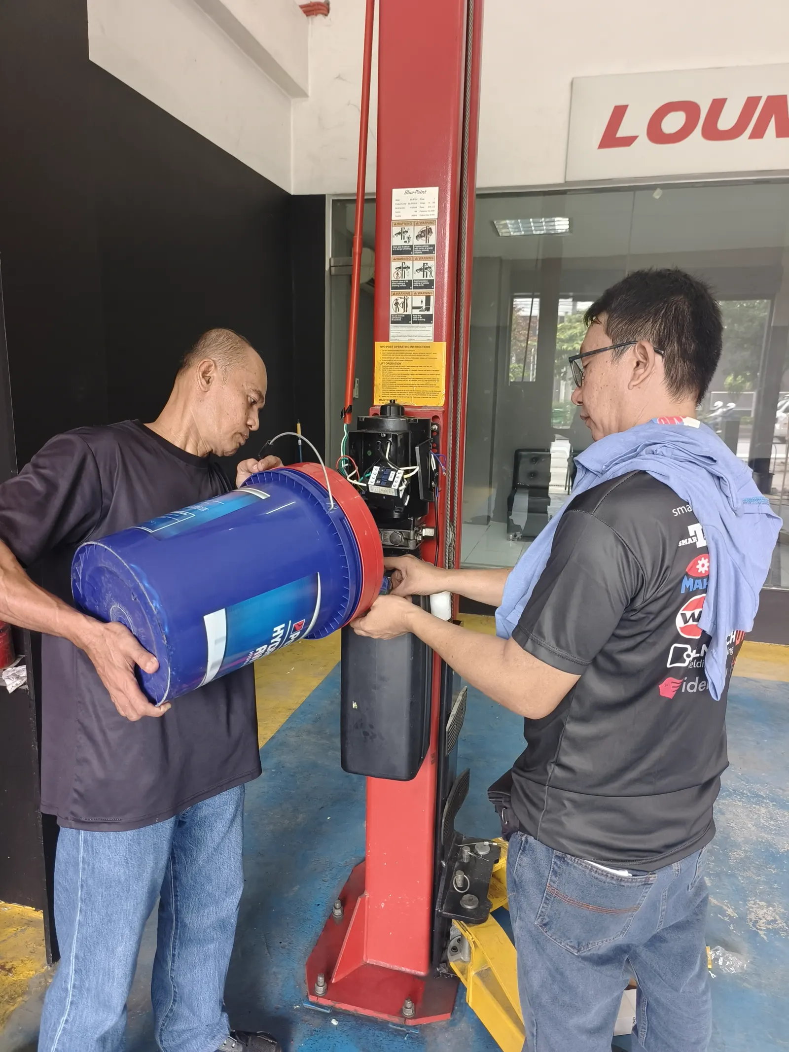 E&A team members working on automotive equipment